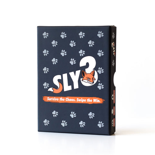 Sly3 card game box front: navy box with white paw prints and an orange fox. Fast family party card game for 2 to 6 players.
